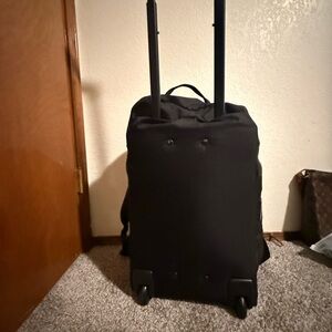 Black Luggage with Telescoping Handle and Textured Fabric